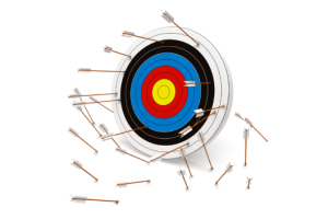 Archery target with numerous arrows embedded in the rings, some scattered on the floor nearby.