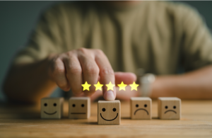 Five yellow stars above wooden blocks with faces, indicating a five-star rating.